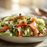 Fresh cucumber lox salad with dill on marble surface