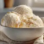 Low calorie high protein Ninja Creami vanilla ice cream served in a chilled pint.