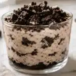 High protein Oreo Cheesecake with creamy filling and crushed Oreo topping